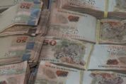 Trio  preso em central de falsificao de documentos com R$ 53 mil